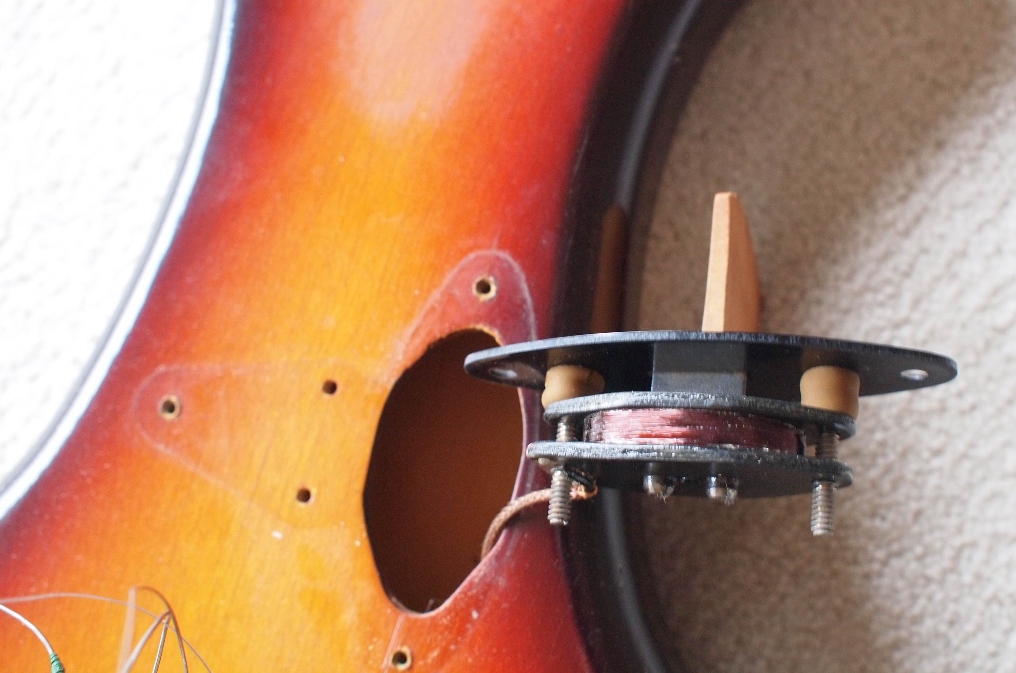 unique pickup device inside an old 1958 Fender